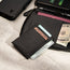 Detachable card holder included in the Black Leather Solo Travel Wallet