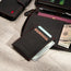 Detachable magnetic card holder included with the Black Leather with Red Stitching Solo Travel Wallet