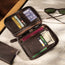 Dark Brown Leather Solo Travel Wallet containing multiple cards, passport, boarding pass and currency