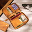 Inside of the Tan Leather Solo Travel Wallet with card slots, boarding pass, currency and passport